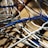 A close-up of various electric cables neatly arranged on a wooden surface.