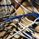 A close-up of various electric cables neatly arranged on a wooden surface.