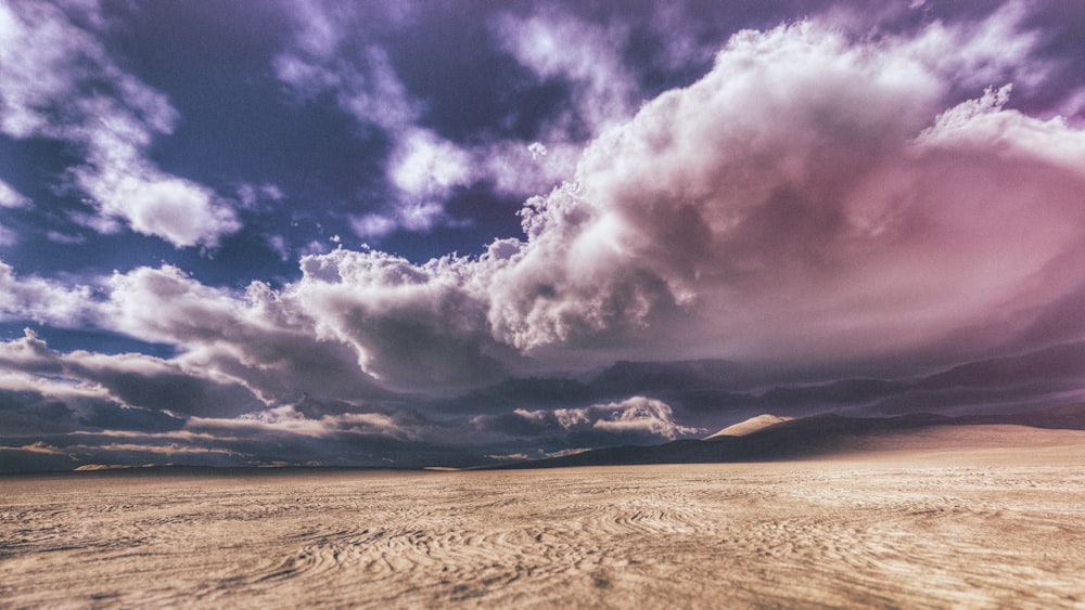 empty desert under gray couldy sky