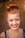 woman taking photo while showing smile