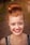 woman taking photo while showing smile