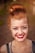 woman taking photo while showing smile