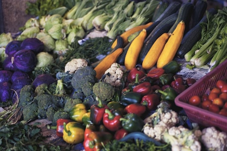 Assorted frozen vegetables in clear bags displayed on a market stall