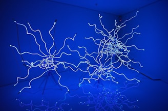 Modern bioenergy pod installation glowing softly with teal neon accents.