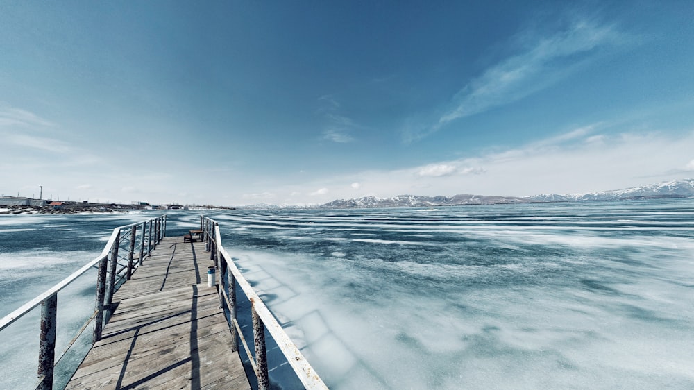 concrete bridge with railings under clear sky