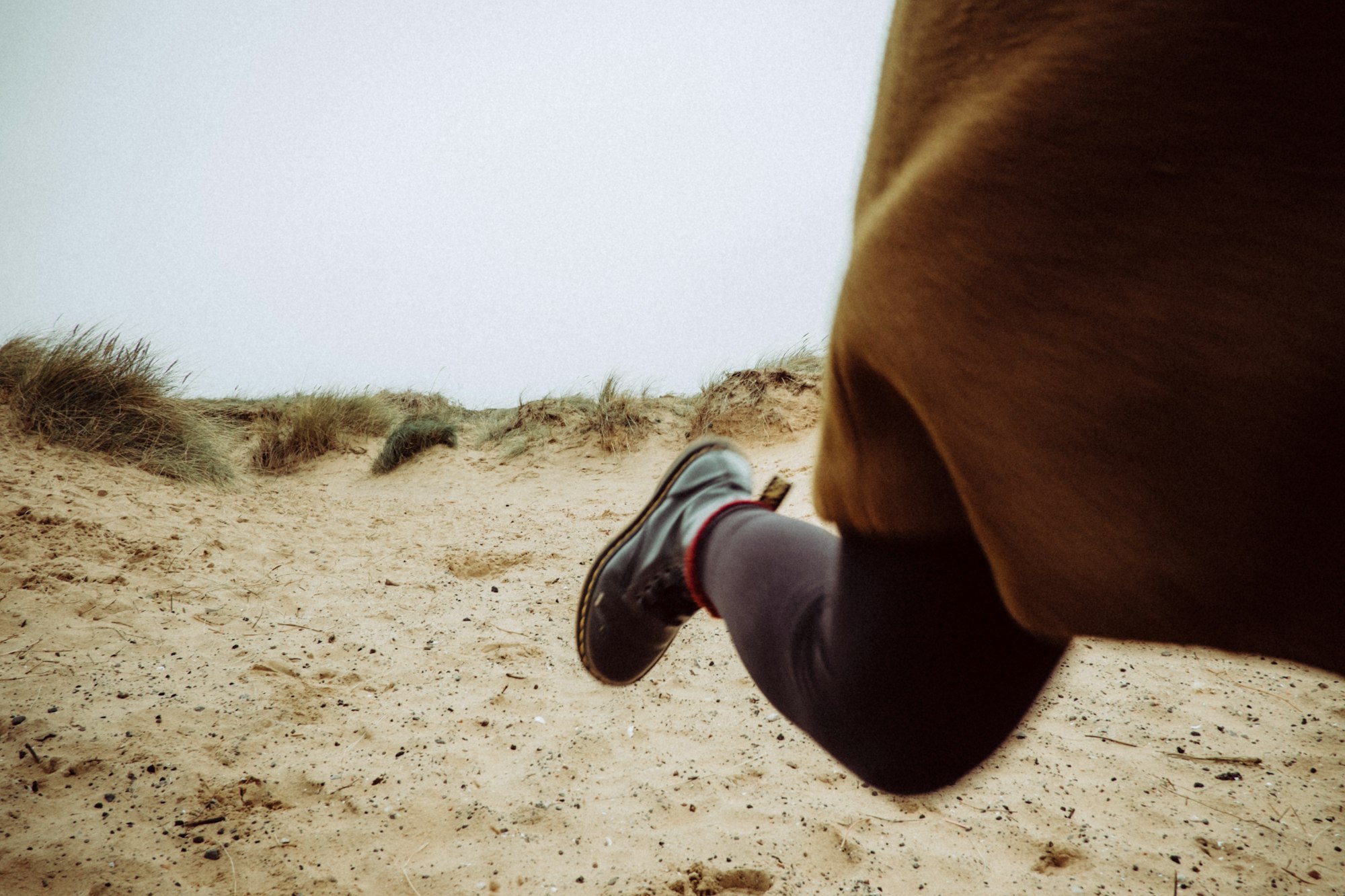 One leg in boots while running