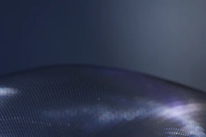 Side view highlighting the textured surface and metallic accents of a Hippo Industries mat under ambient lighting.