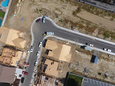 aerial view of vehicles on asphalt road drone view google meet background