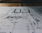 High-resolution architectural blueprint print spread out on a table