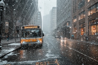 yellow and black bus on asphalt road between buildings during daytime