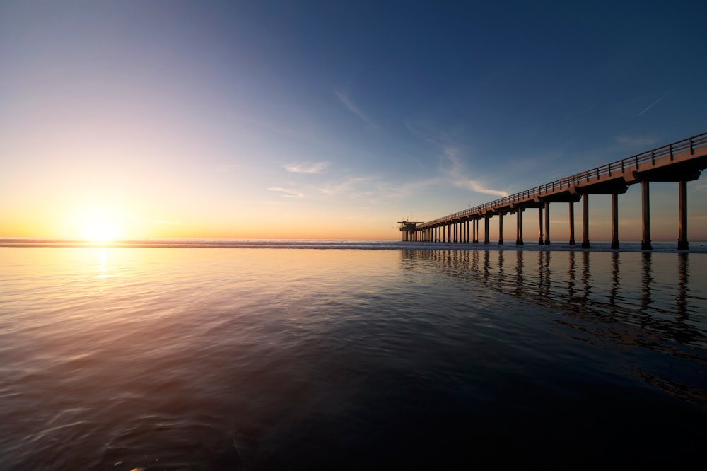 brown wooden dock under clear blue sky during daytime