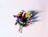 A collection of colorful pens and markers are arranged in a pink container, viewed from above. The items display a variety of colors, including red, green, yellow, blue, orange, and black. The container contrasts against a plain white background, emphasizing the vividness of the pens.