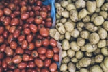 photography of orange tomatoes and brown potatoes