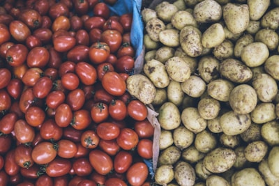 photography of orange tomatoes and brown potatoes
