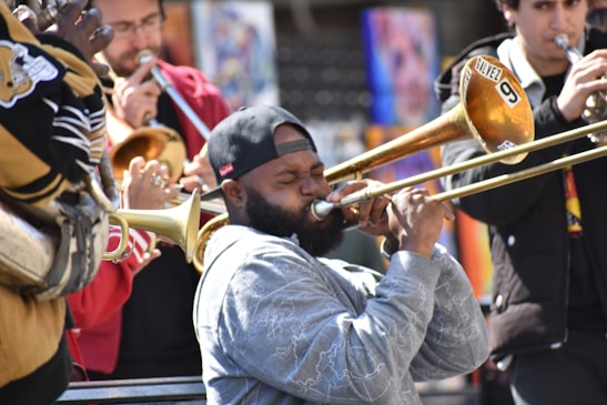Close-up of the band's horn section playing passionately during a lively set.