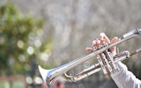 person playing trumpet outdoor