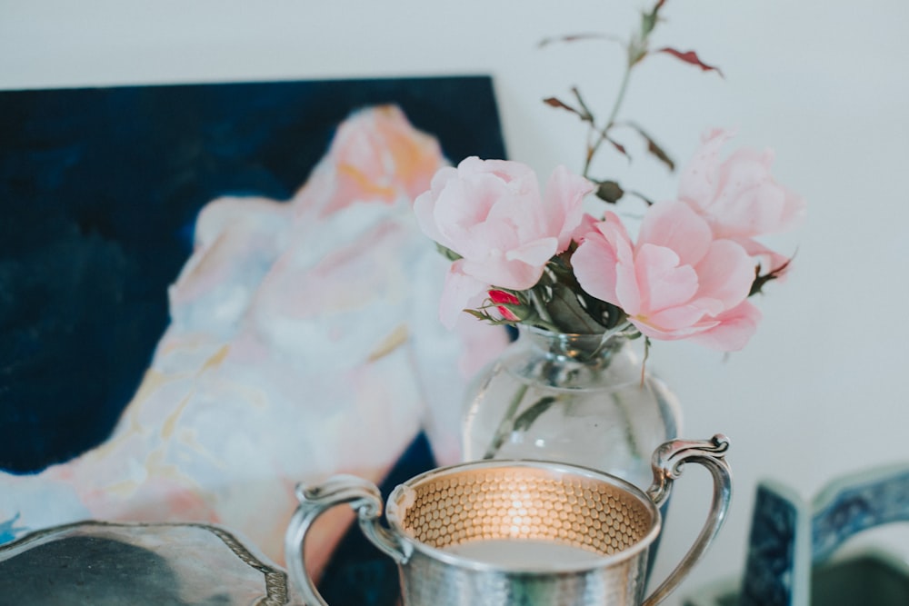 pink flowers on clear glass vase