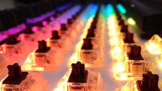 A vibrant photo showing a variety of colorful mechanical keyboards arranged neatly