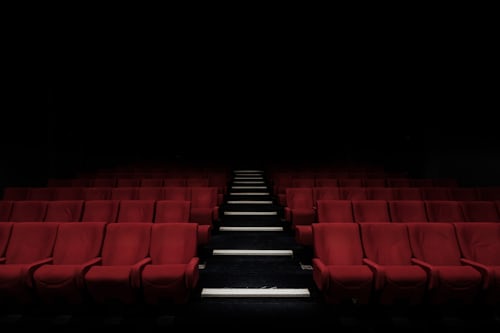 Movie theatre with red chairs