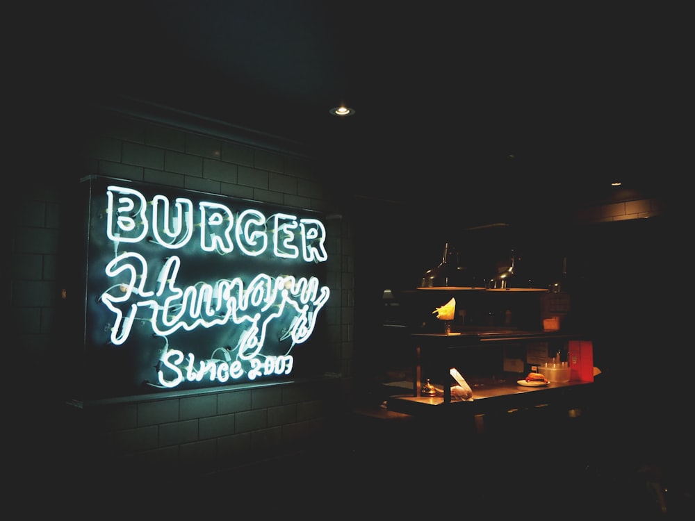 Burger Hungry neon signage mounted on white painted wall