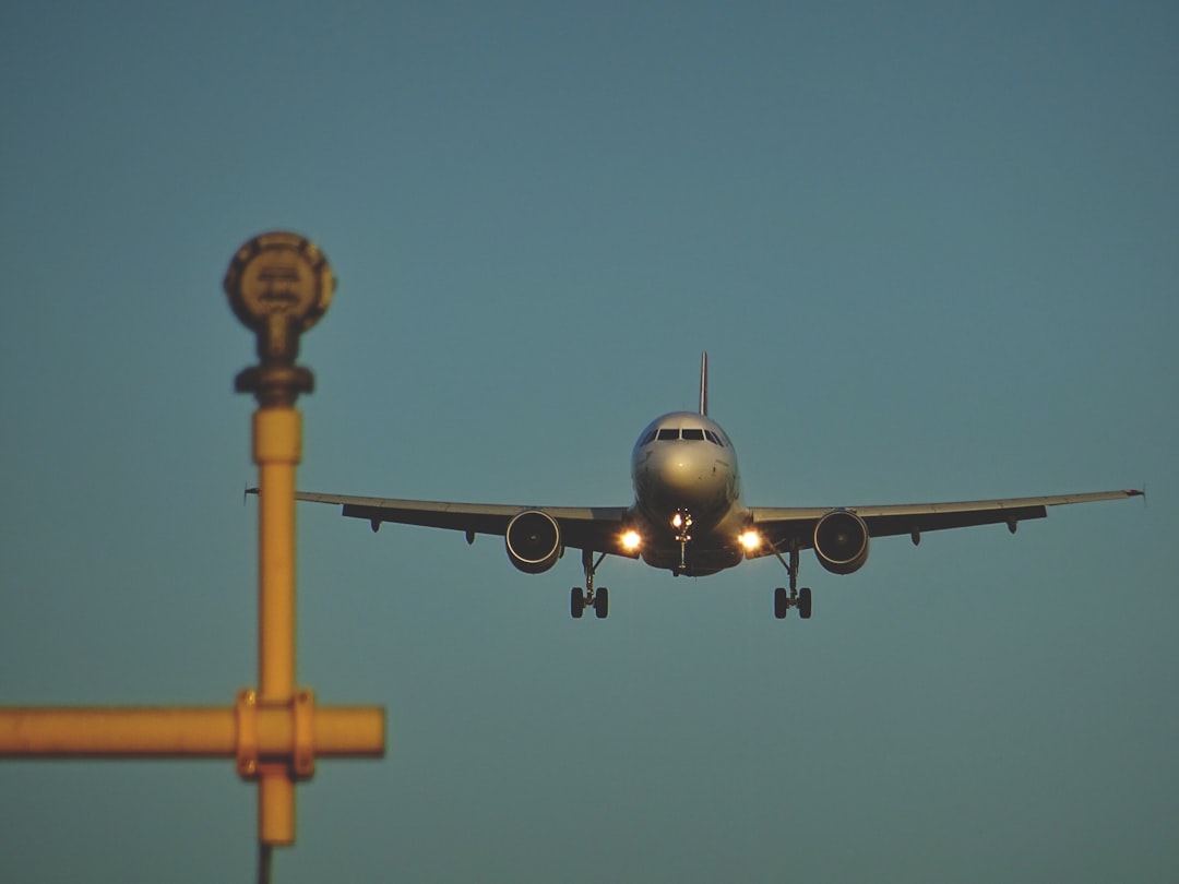 flying gray airplane, Landing