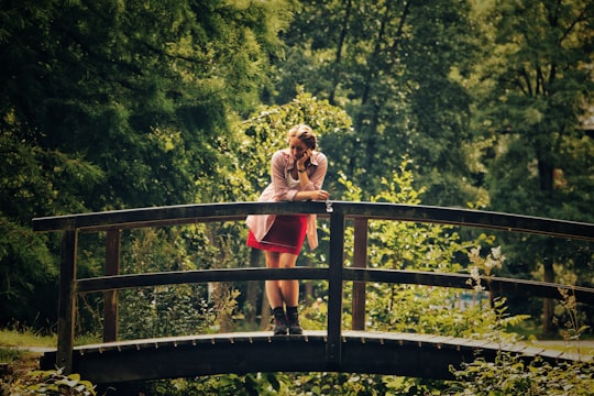 woman standing on bridge in Viktoriapark Germany