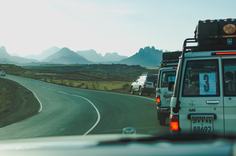 vehicles travelling on road during daytime