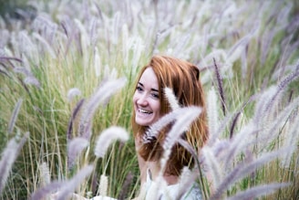 woman sitting on grass field