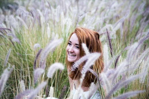 woman sitting on grass field