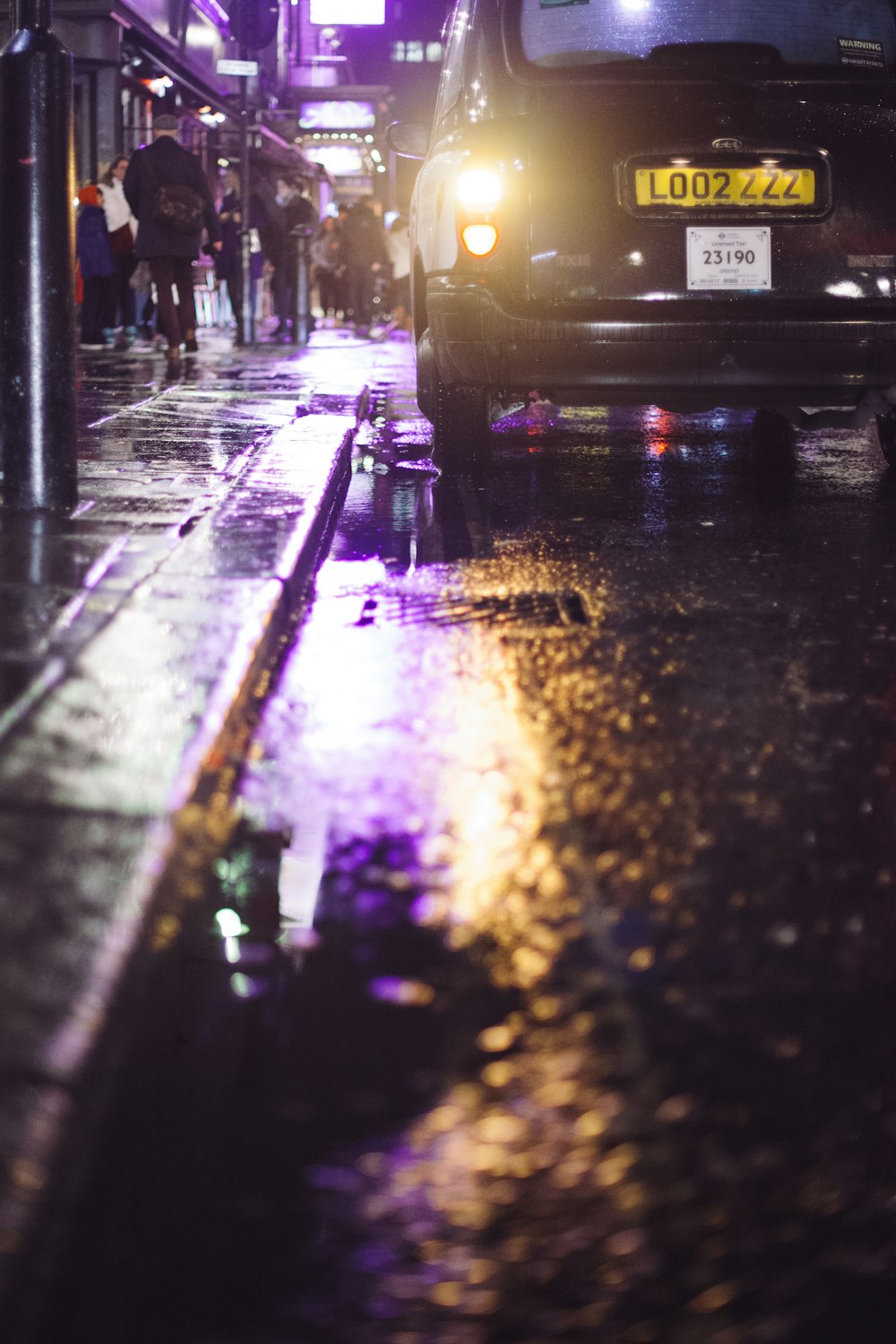 black vehicle passing on road