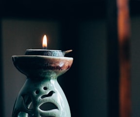rule of thirds photography of lit candle