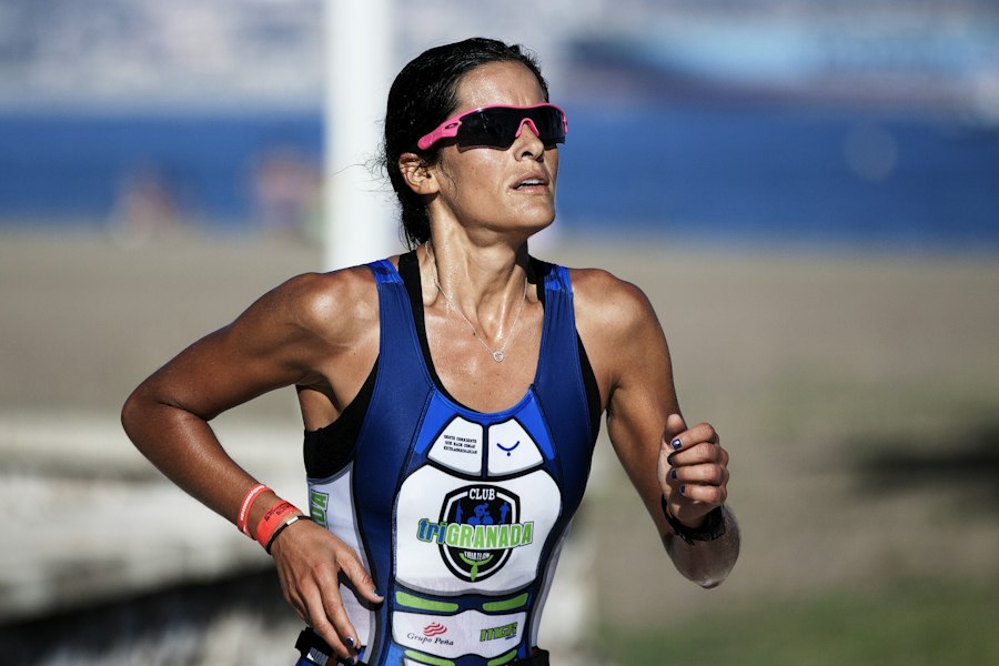 Female triathlete running during a race