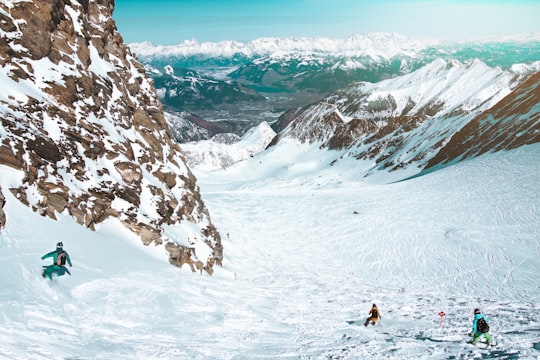 person snowboarding near mountains in Kitzsteinhorn Austria