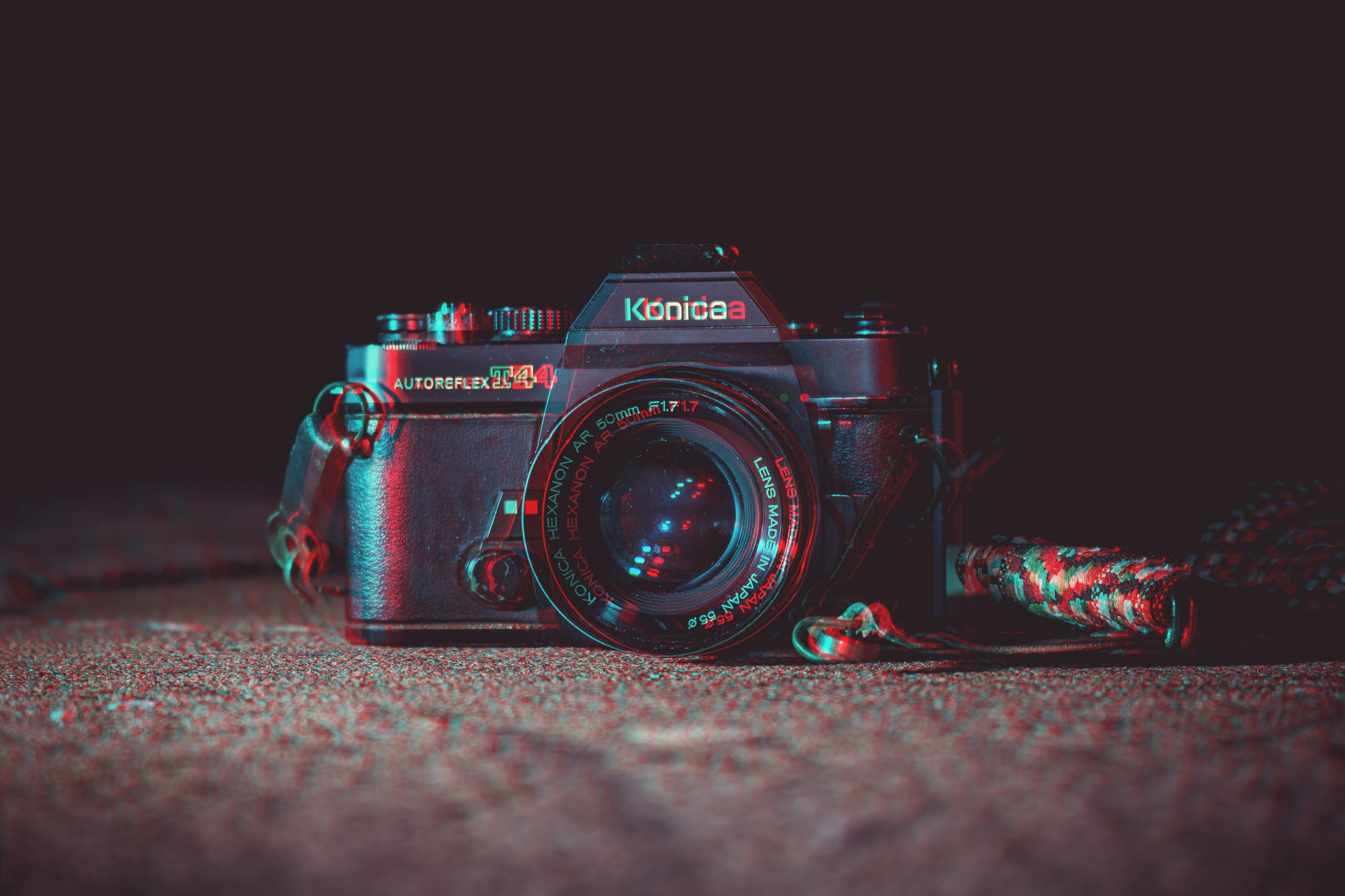 shallow focus photography of black Konica DSLR camera