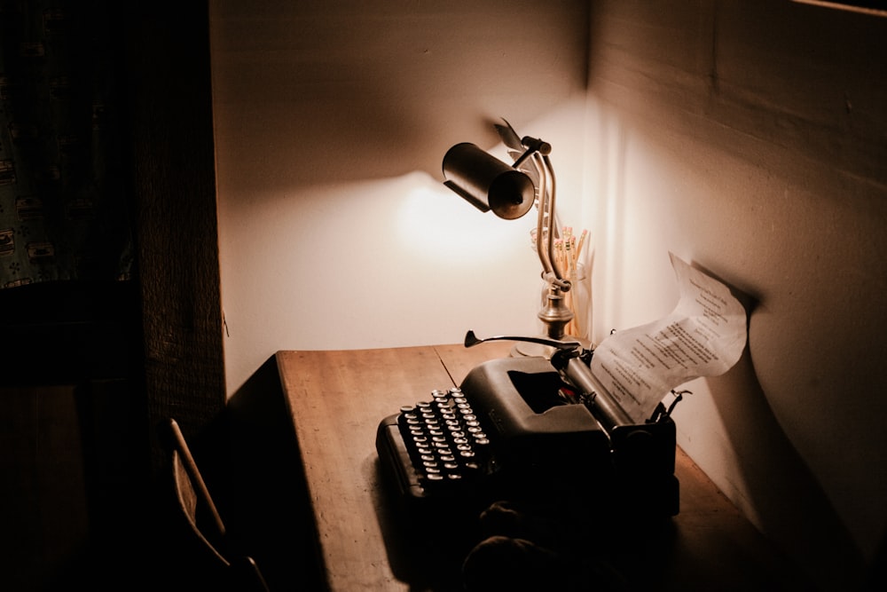 A typewriter and a lamp sitting on a desk Bowen Island