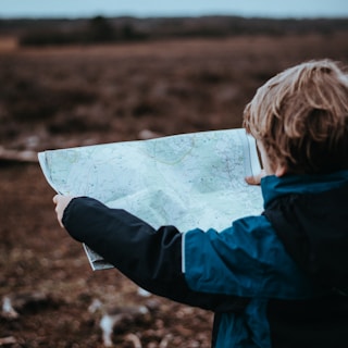 child looking at map