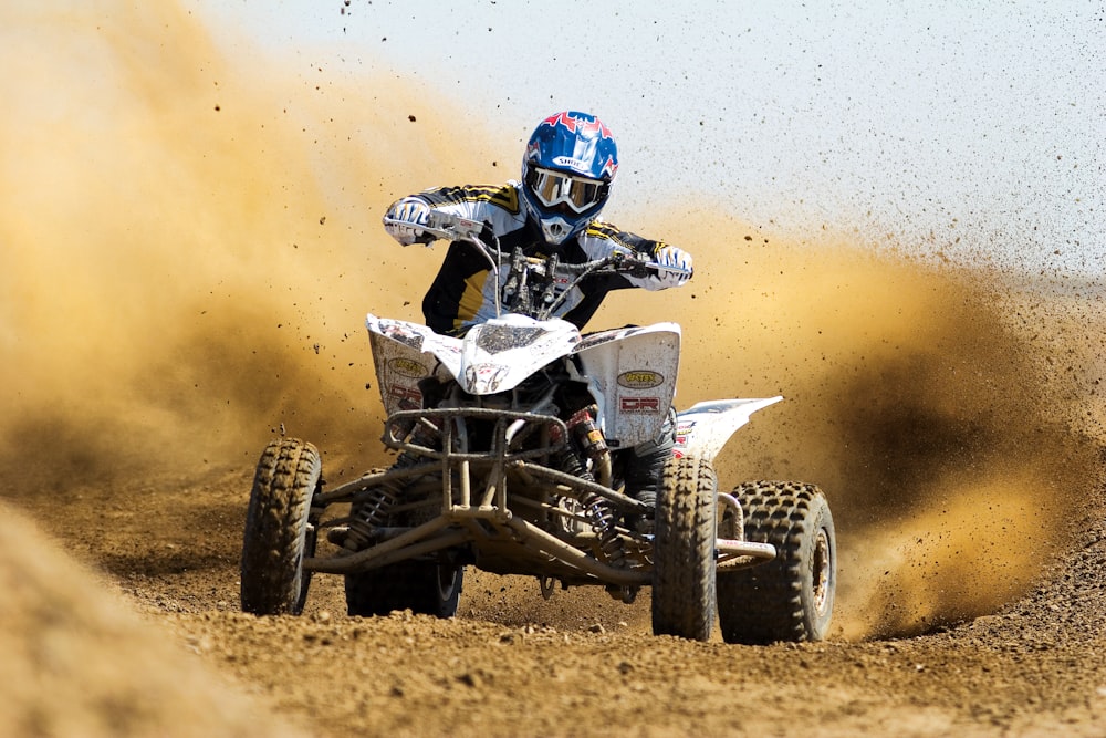 man riding ATV on the dessert