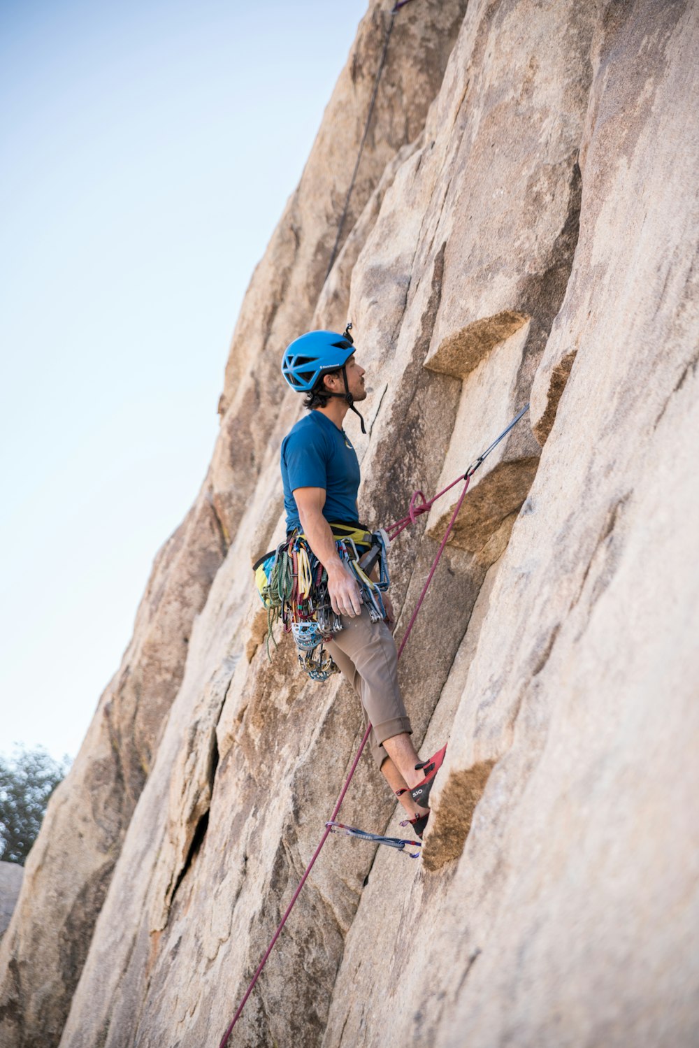 man doing rock climbing at daytime