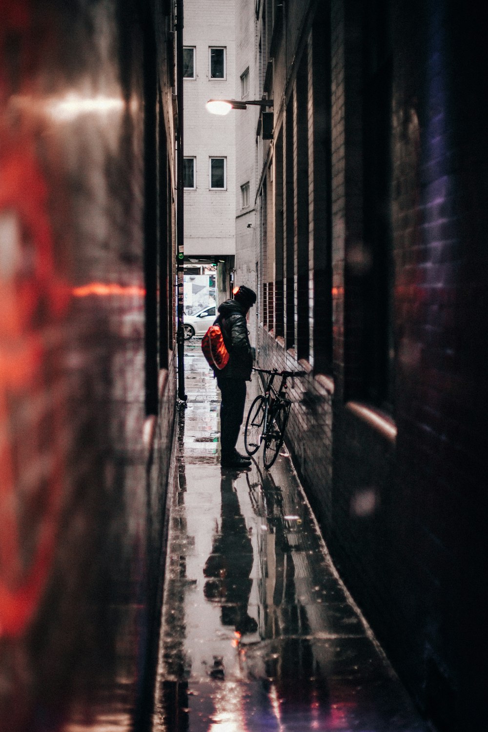 tilt shift lens photo of person and bicycle