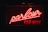 A bright red neon sign with the words 'parlour' written in elegant cursive and 'FOR HIRE' in block letters underneath. The background is dark, making the vividness of the neon light stand out prominently.