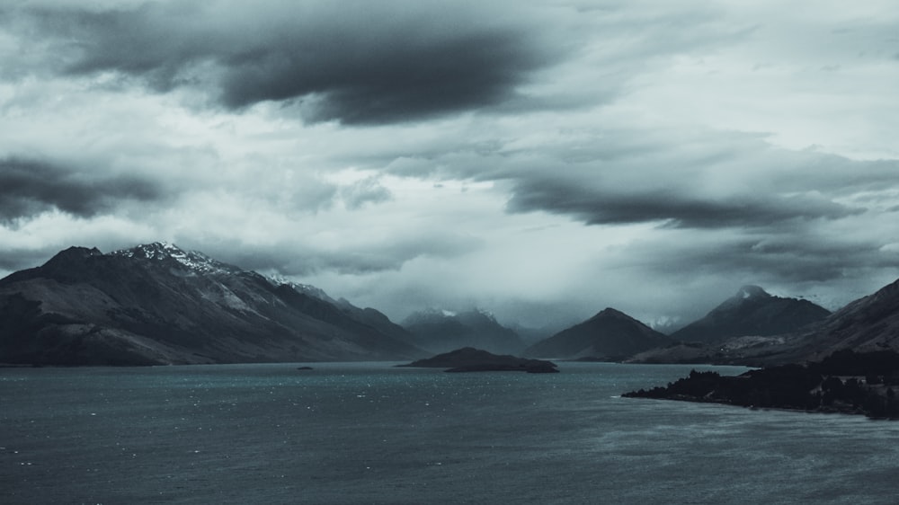 body of water near mountain