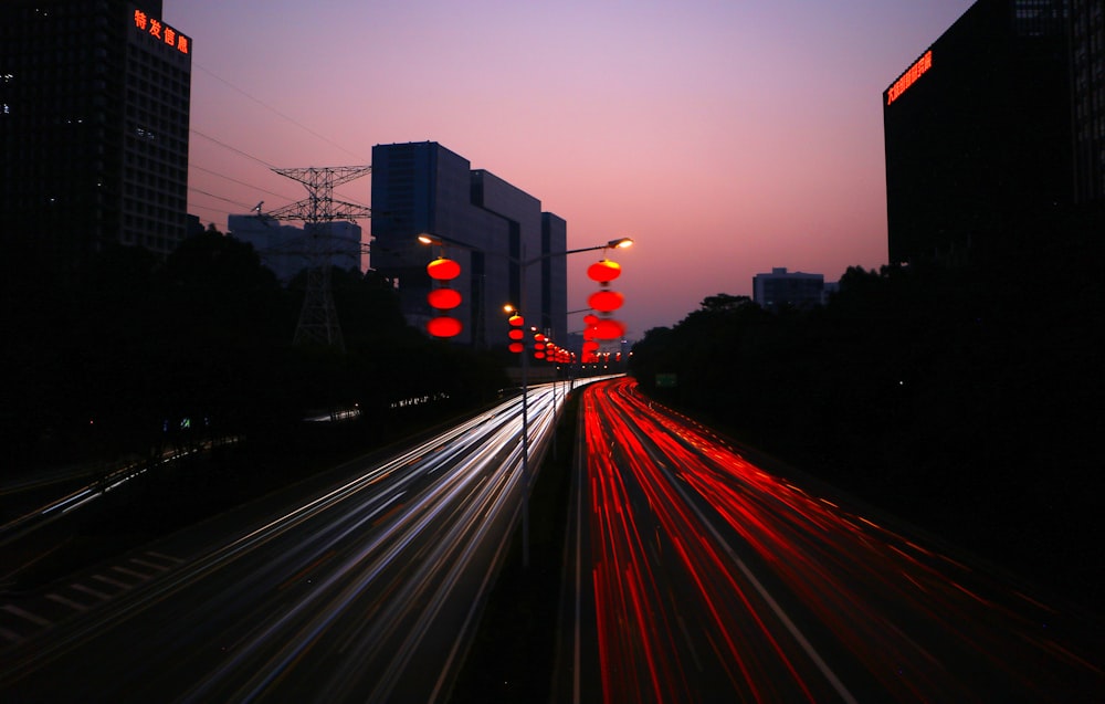 timelapes photography of car lights on road during night time