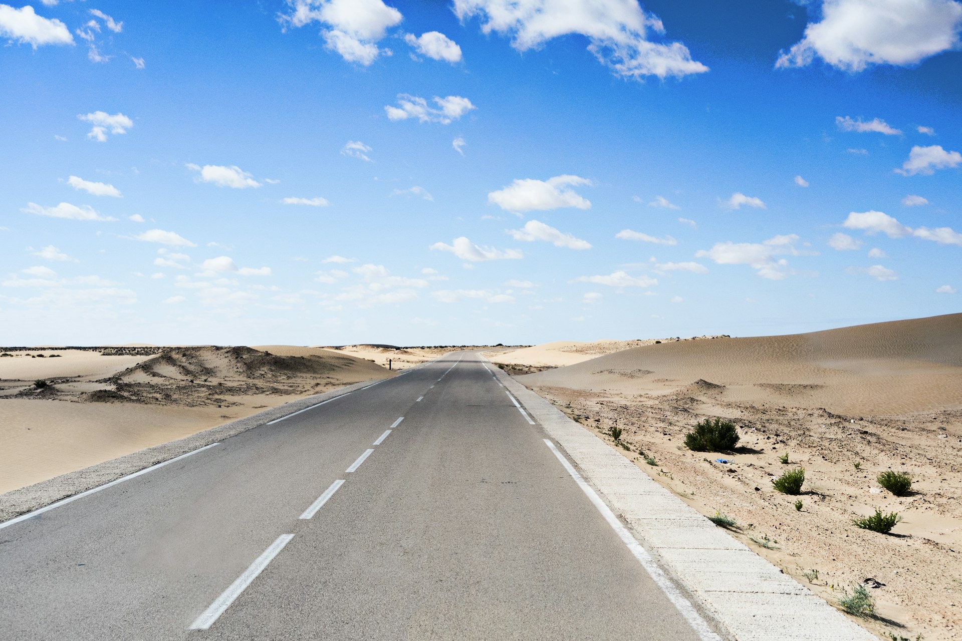 architectural photography of gray road