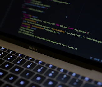 MacBook Pro with images of computer language codes