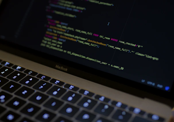 MacBook Pro with images of computer language codes