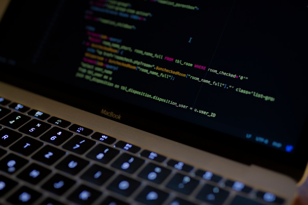 MacBook Pro with code on screen