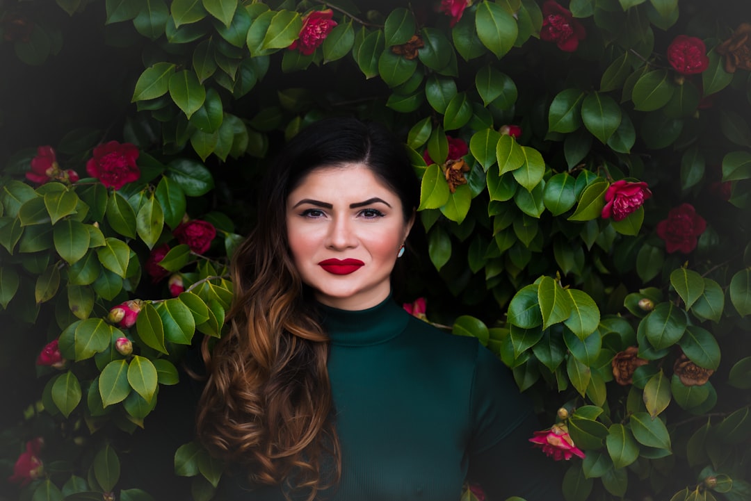 woman standing near green tree