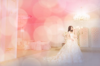 Elegant wedding planner discussing details with a couple in a softly lit room.