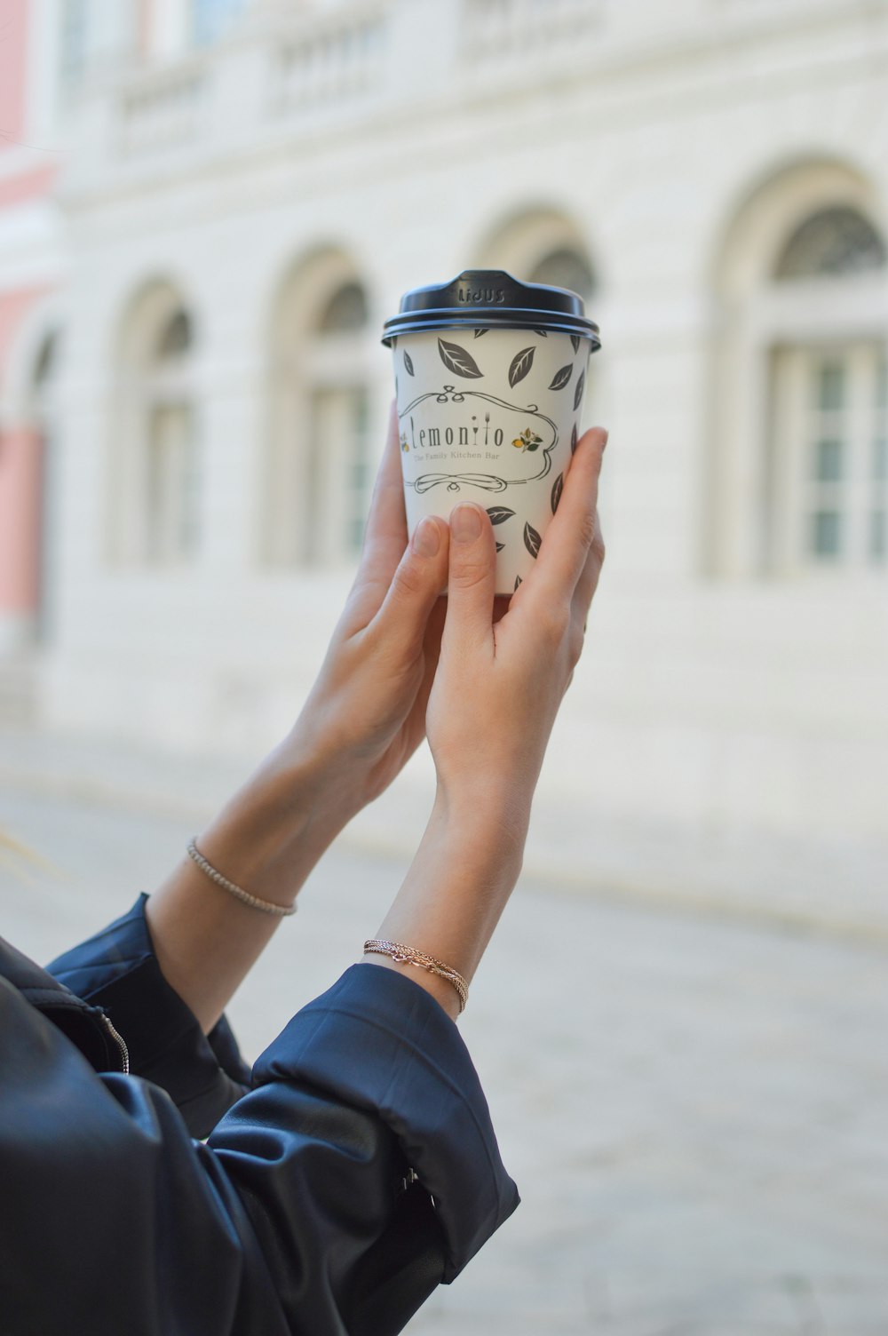 person holding cup