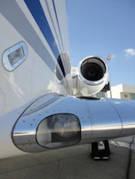 A close-up of a polished jet engine gleaming under the Miami sun.